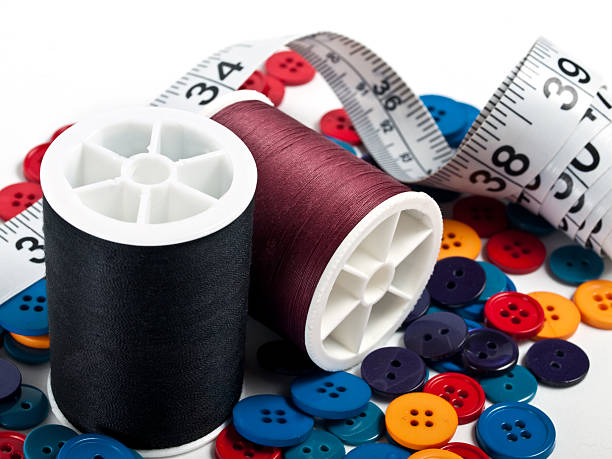 Sewing Thread, Tape, and Buttons stock photo