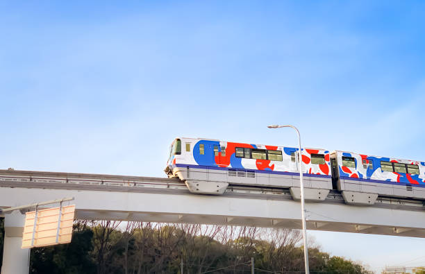 Osaka, Japan - Feb 12, 2023: “EXPO TRAIN 2025 Osaka Monorail” on sky background, a special vehicle decorated with the design used on the official logo, Myaku-Myaku, of the World Expo held in Osaka, Kansai, Japan in 2025.