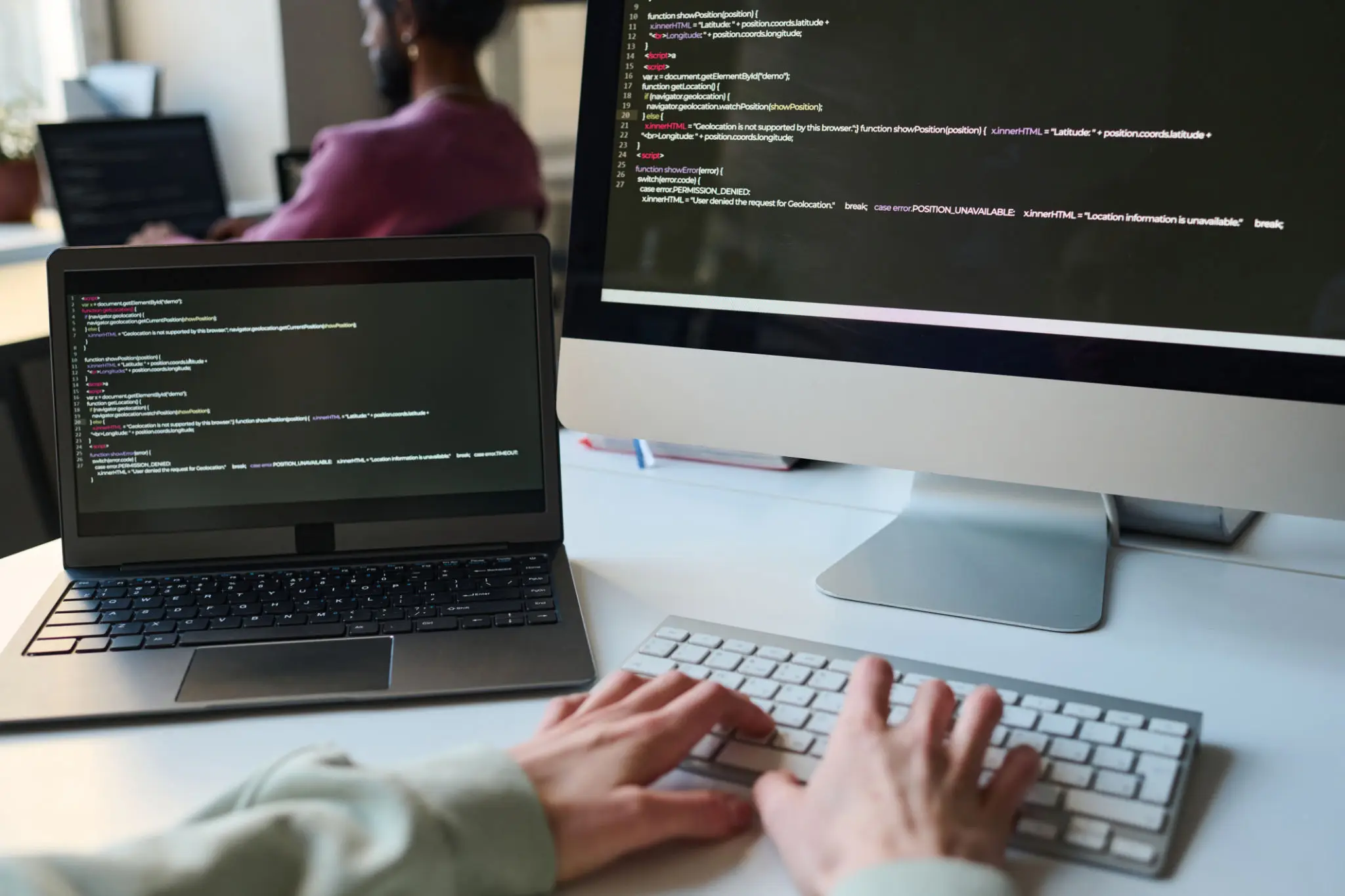 Programmer typing codes for computer program