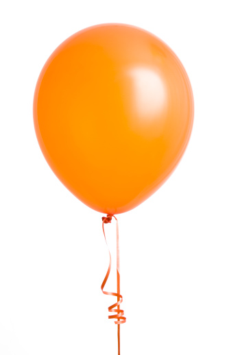 Vibrant orange balloon isolated on white background