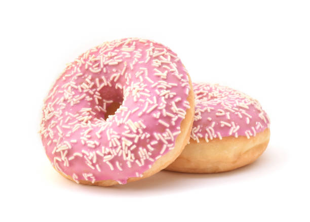 istock Pair of pinky glazed donuts isolated on white 1469093531