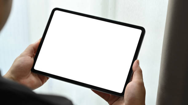 istock Close up view of man hands holding mock up digital tablet. White empty screen for text information or content. 1469093923