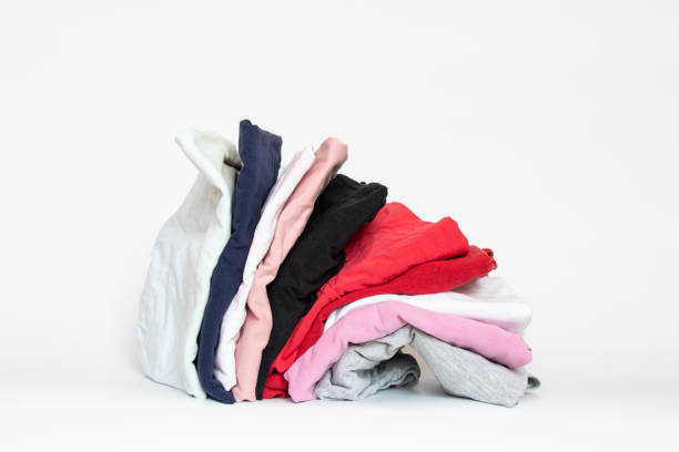 istock A stack of folded things on a white background close-up, a lot of clothes 1469094367