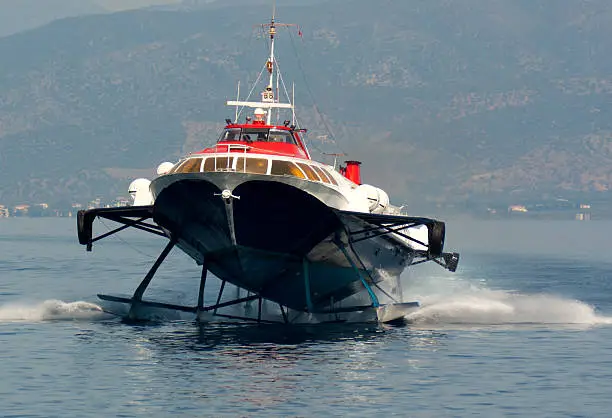 A hydrofoil approaching the port of the greek island Hydra.