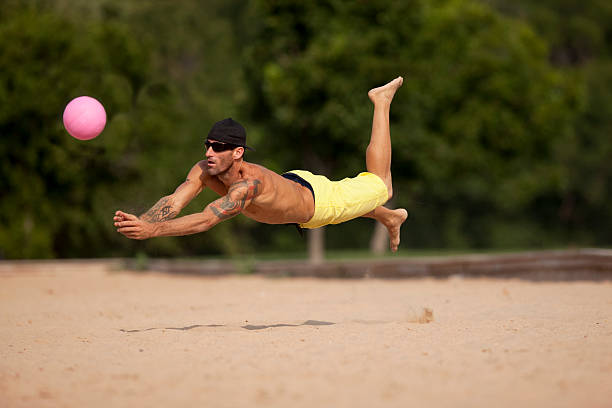 istock Male Athlete Playing Sand Volleyball 146909656