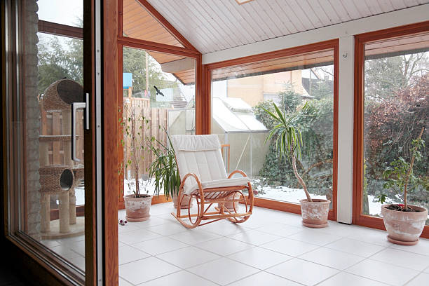 Conservatory modern conservatory with a glass sliding door to the living room jacques heim stock pictures, royalty-free photos & images
