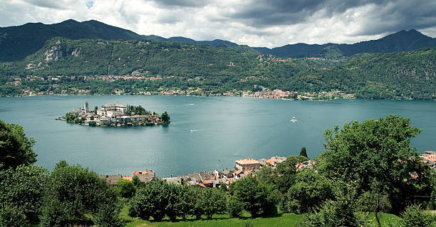 istock panorama ,Italian lake with isle,clouds and mountains 146910368