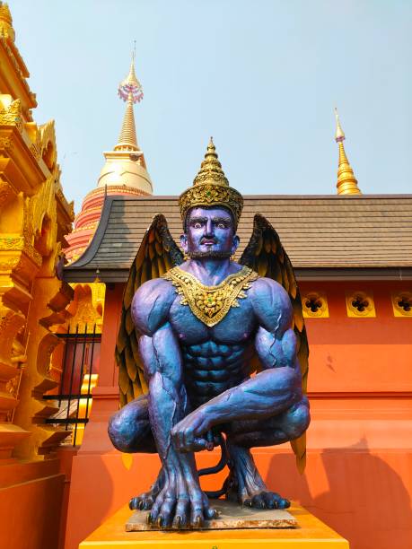 god statue in thai temple stock photo