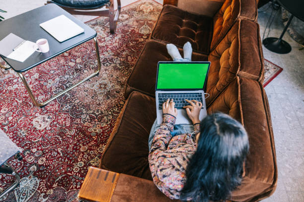 istock Young Indian woman using laptop at home 1469108109