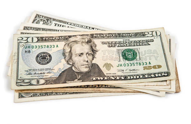 istock dollars isolated on white background. studio shot. cash money 1469108405