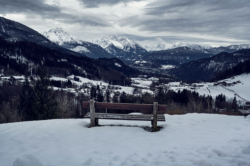 Empty bench with beautiful alpine view
