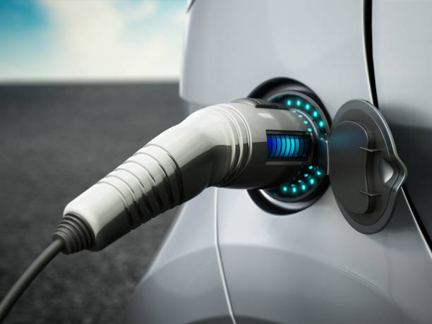istock Electric car being charged up with a modern charger using charging battery station.  Sustainable and environment friendly energy concept. 1469109044