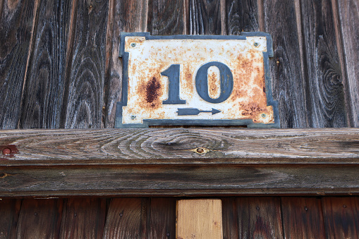 House number on an old wooden door