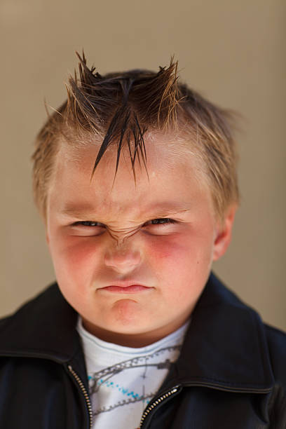 Boy Scowling stock photo