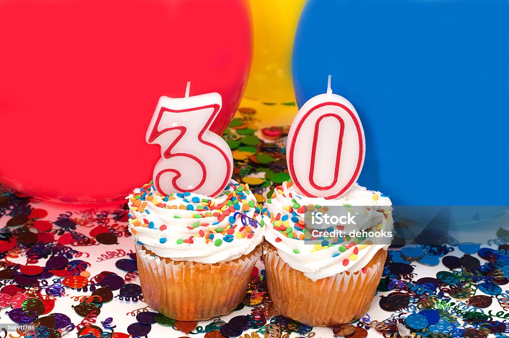 Celebration with Balloons, Confetti, and Cupcake Celebration with balloons, confetti, cupcake, and number 30 candle. Balloon Stock Photo