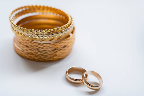 Gold Bracelets on white background