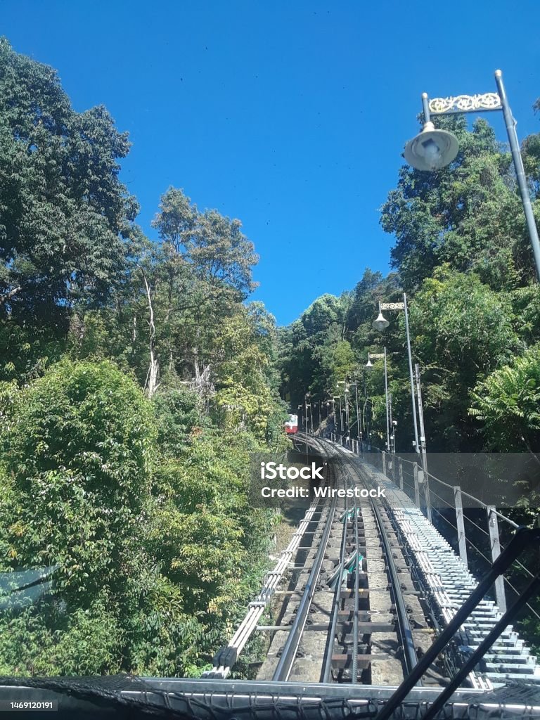 Train Climbing up Penang Hill Train track on Penang Hill, Malaysia Arch - Architectural Feature Stock Photo