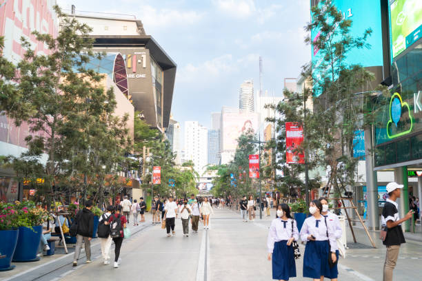 people walk to the new look of siam square in bangkok thailand. siam square is popular among teen and tourists in thailand. - siam square imagens e fotografias de stock