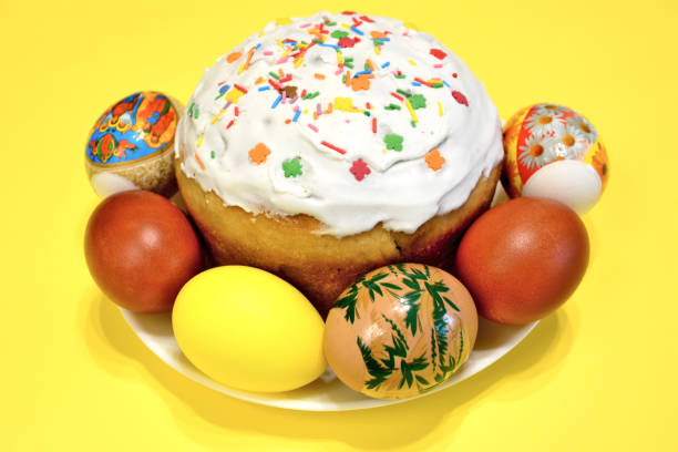 istock A plate of easter eggs and an easter cake with  multicolored sprinkles on it, close-up 1469123461