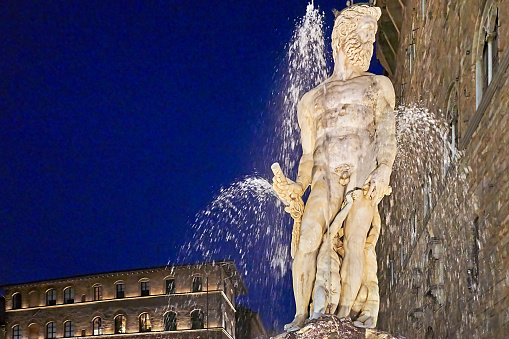 Florence, Italy - September 05, 2022: Fountain of Neptune in Piazza della Signoria at night.