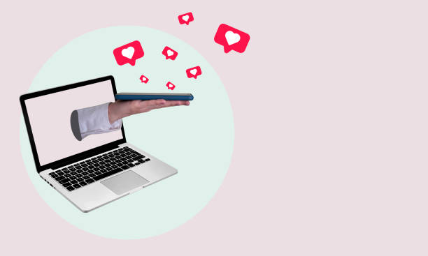 istock Art collage from phone hearts, hand from laptop on light background. 1469125724