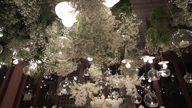 Close-up wedding decor floral arch dinner. Festive fine setting table row chair flower reception party.