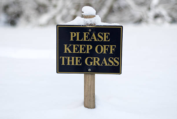 Please keep off the grass stock photo