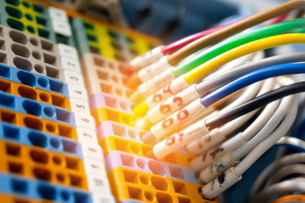 istock Network cables connected to switch. Many multi-colored wires connected to digital hub. Background close-up. 1469127817