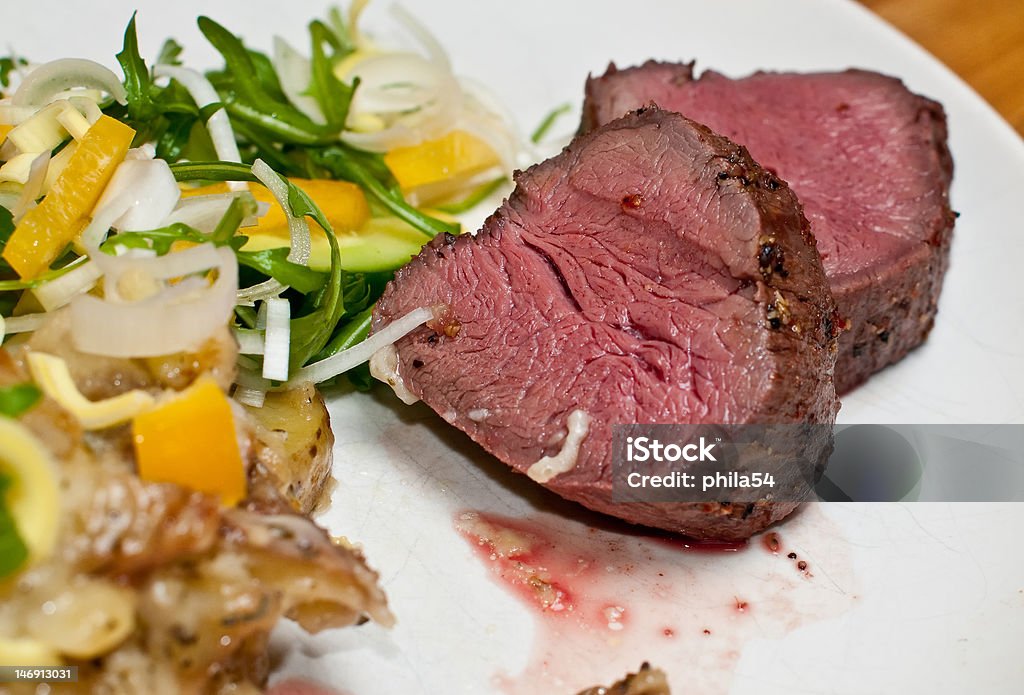 Fillet Fillet medium rare on a white plate with vegetables Beef Stock Photo