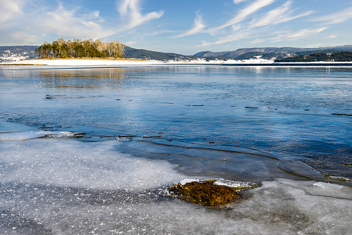 Frozen Baikal Lake. Magnificent winter landscape. Ice travel and outdoor activity.