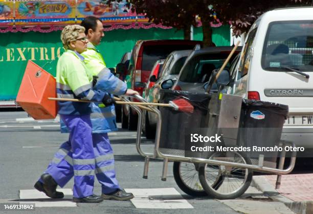 Street Sweepers Pushing Cart And Equipment Stock Photo - Download Image Now - Cleaning, Street, Men