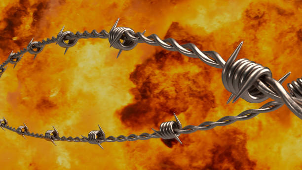 istock The  barbed wire on fire background  for security or military concept 3d rendering 1469133529