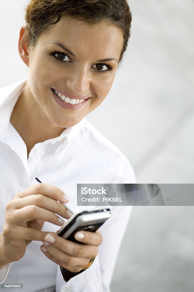 Empresária usando palmtop - Foto de stock de Adulto royalty-free