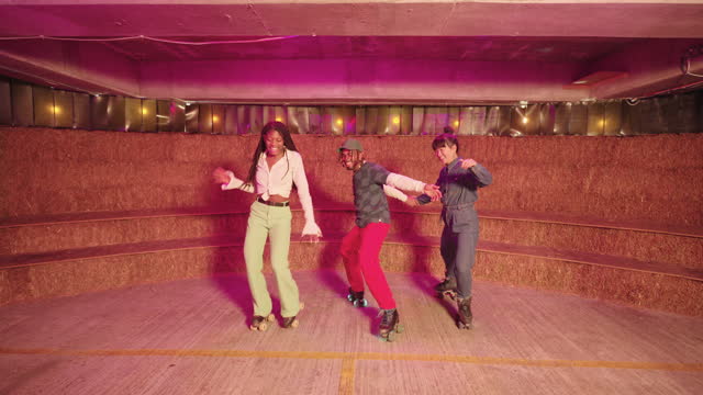 Freestyle jam skaters dancing under neon disco lighting