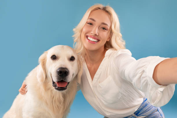 istock Young woman taking selfie with her happy dog 1469136564