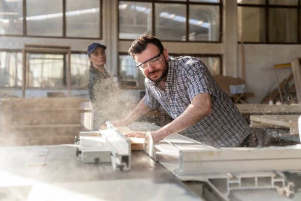 istock Man cutting on a circular saw in a carpentry workshop. 1469138123