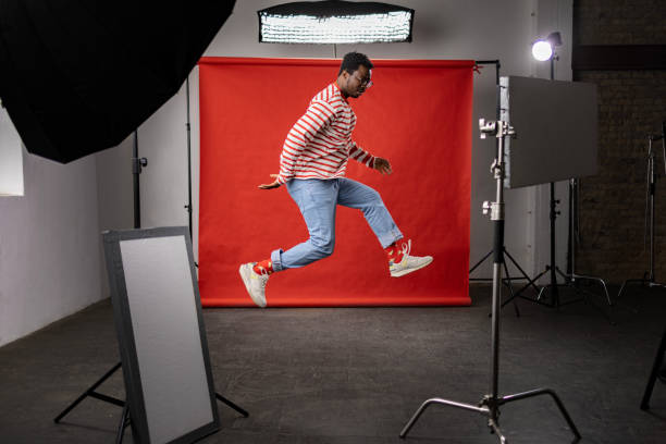 istock Carefree black man jumping in a professional studio. 1469138645