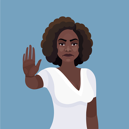 Young  African American woman making stop gesture with palm of her hand.