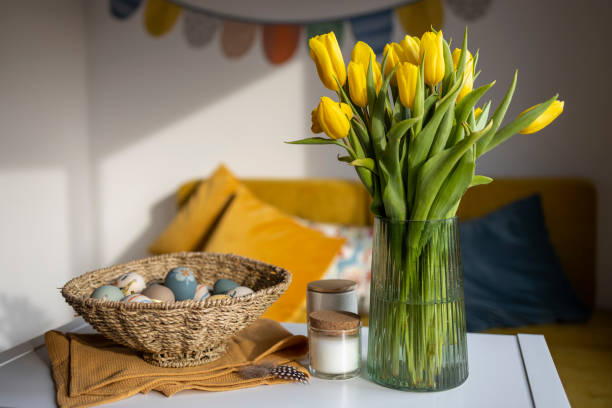 istock Yellow tulips and Easter eggs in basket 1469139045