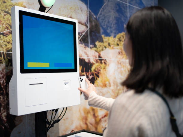 istock Woman using self-service cash register to checkout 1469139178