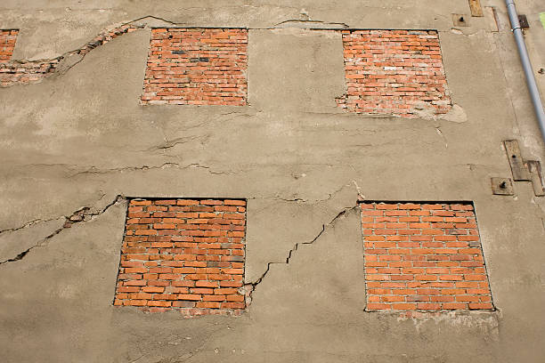 istock Damaged building wall and blocked windows 146914014