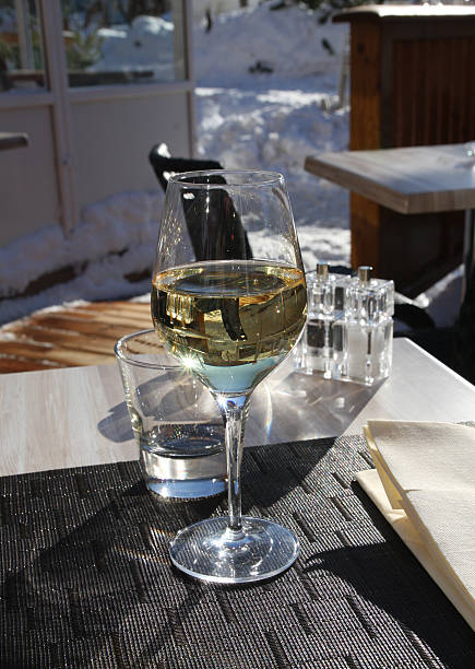 istock Glass of white wine on the table. 146914048