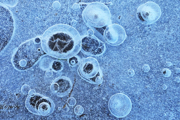 istock Frozen Water With Bubbles Of Air Catched Under The Ice 1469140486