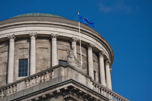 four courts dome with EU flag on blue sky, Dublin