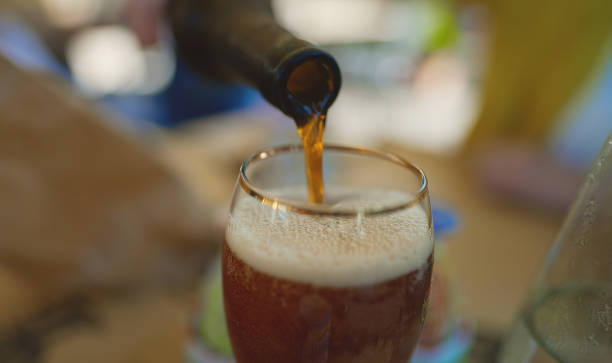 istock Pouring beer into the glass. 1469141195