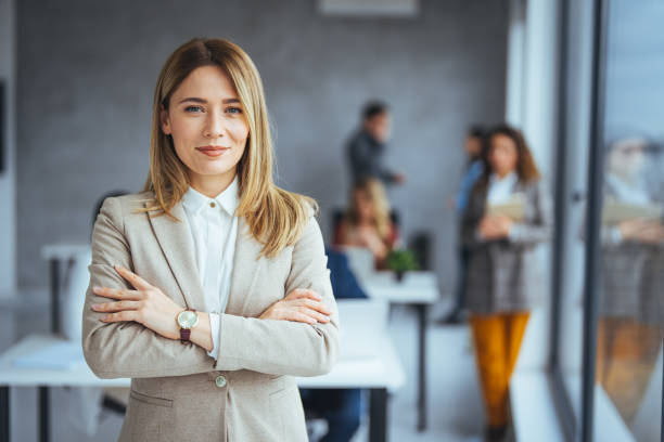 istock Successful businesswoman standing in creative office and looking at camera. 1469143040