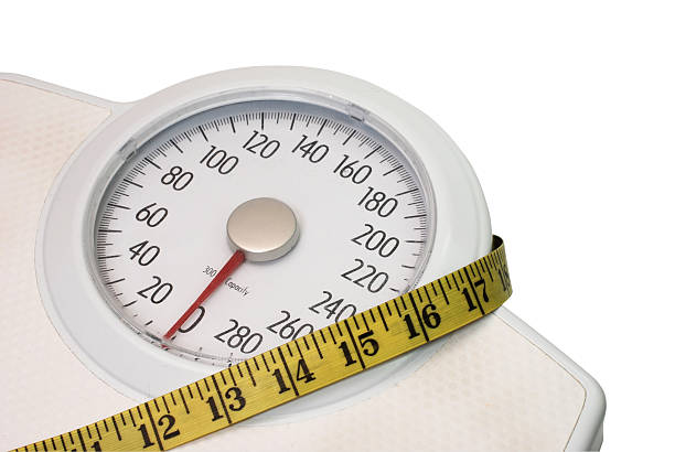 istock Bathroom Scales and Tape Measure 146914343