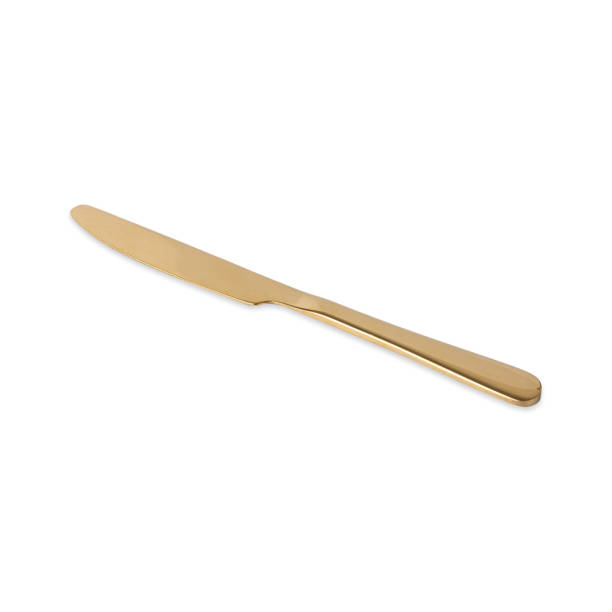 istock Golden metal knife isolated over white background 1469144510
