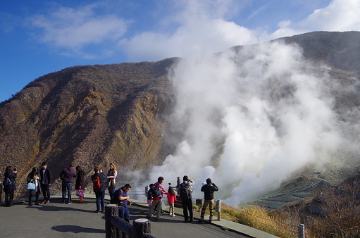 Kanagawa Hakone,Japan – November,12 2016:This is a sightseeing place in Japan, Owakudani of Hakone.
This area was known as Jigokudani (Hell Valley) up until the Edo Period, and this characteristics scenery has now turned it into a sightseeing spot that is representative of Hakone. You can go to Jigokudani by Hakone Ropeway.It is about 4km long and connects Sounzan Station and Togendai Station.