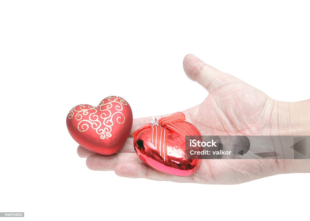 Hand and two hearts Heart Shape Stock Photo